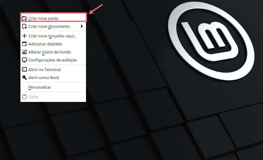 Menu de contexto da Área de Trabalho do Linux Mint, com um contorno coral em Criar nova pasta e uma seta apontando para essa opção.